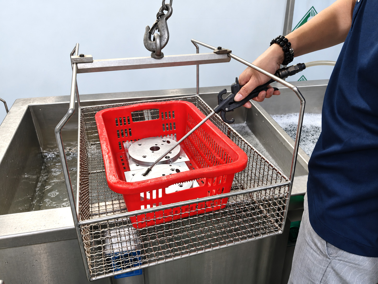 Rinsing of machined components in the Zhongwei workshop.