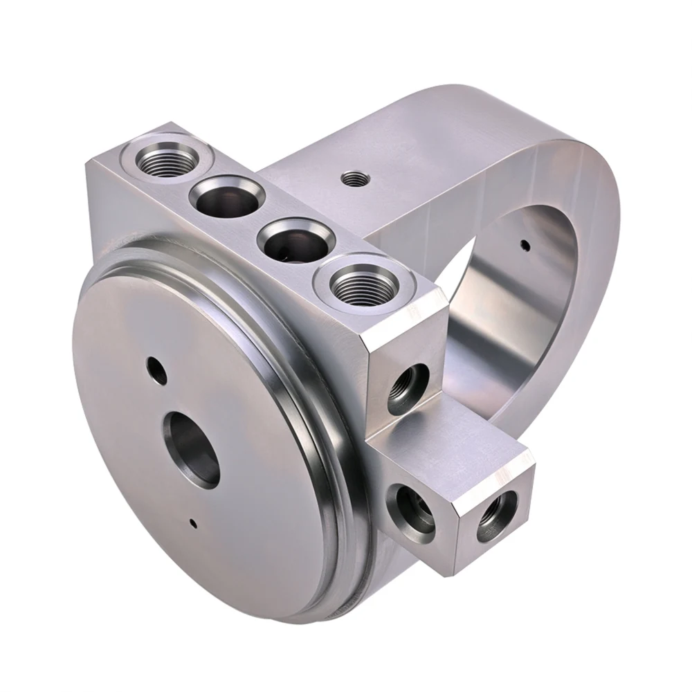 Hydraulic cylinder end cap with integrated valve cavities and machined ports.
